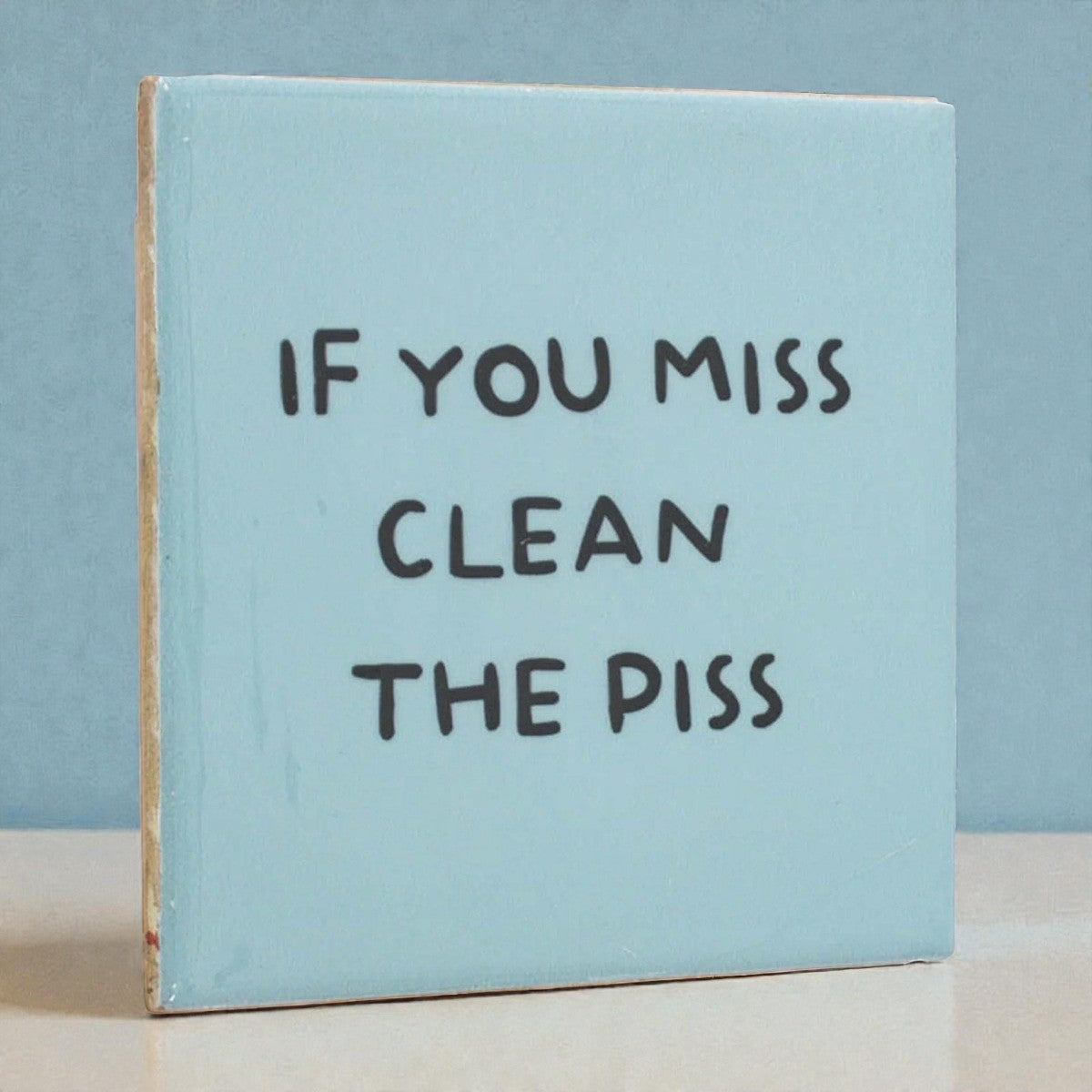 Tegeltje “If you miss clean the piss”